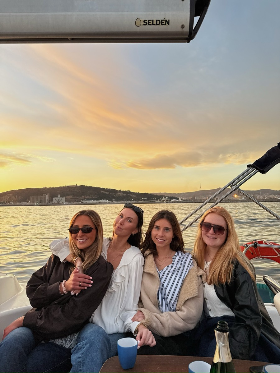 Flextrip travelers on a boat at sunset
